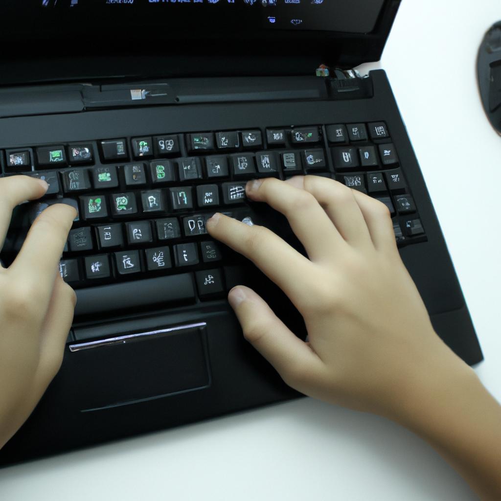 Person using a computer, coding
